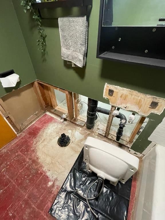 Basement flooding — bathroom repair — before